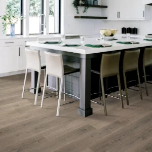 Mohawk Laminate in a gray-brown wood tone in a modern kitchen | Shoreline Flooring