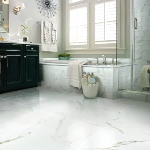 Shaw Floors Calacatta Oro polished white marble-look tile in a luxurious bathroom | Shoreline Flooring