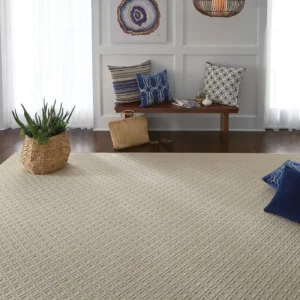 A Shaw Floors area rug in a light sand color | Shoreline Flooring