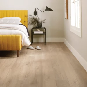COREtec Luxury Vinyl in a light blonde wood color in a laundry room | Shoreline Flooring