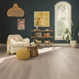 COREtec Luxury Vinyl in a light grayish-brown wood tone in a living room | Shoreline Flooring