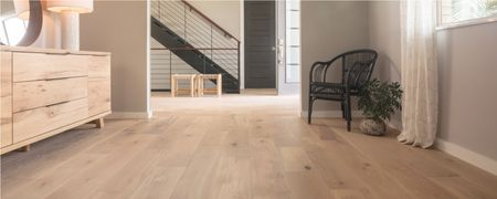 Light wood flooring in a modern home hallway and living space | Shoreline Flooring