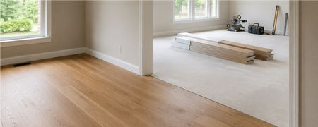 Warm wood flooring in a bright open room | Shoreline Flooring